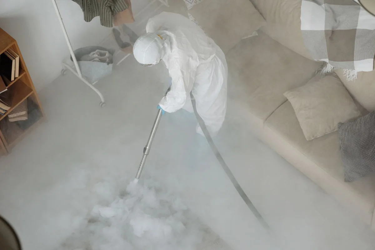 Biohazard cleanup technician in protective equipment, Westborough, MA